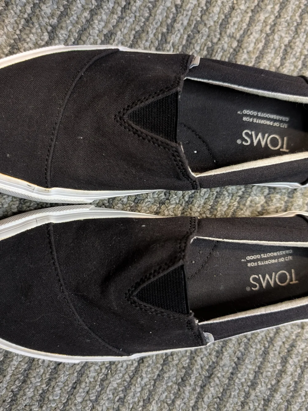 TOMS kids Black Canvas Slip-On Loafers with White Sole